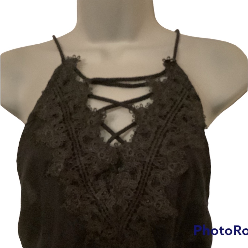 Halter top style jumpsuit. Black Sz M. Figure flattering.